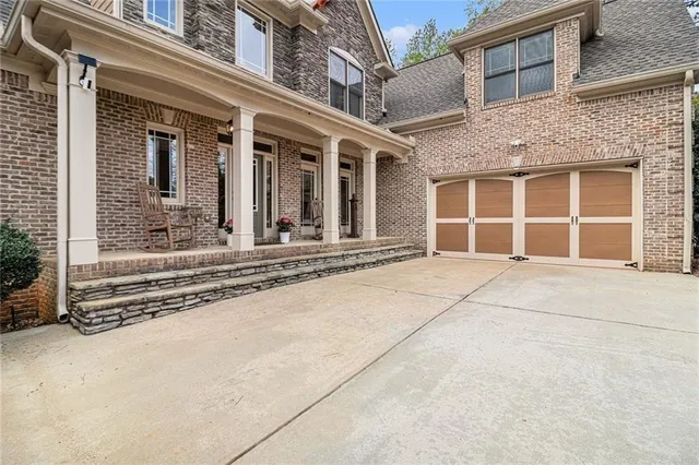 front view of a brick house with a large window