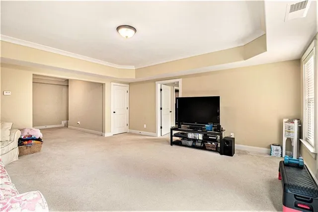 a balcony with wooden floor and fence
