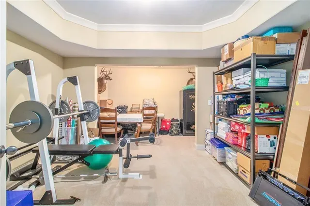 a view of a house with a backyard and trees