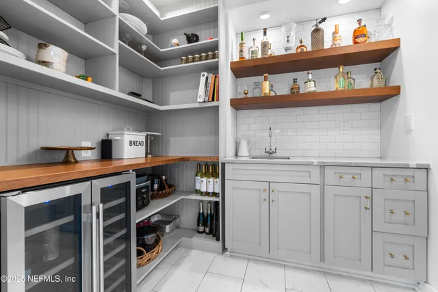 a bedroom with a bed and a chair