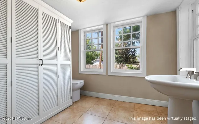 a view of hallway with wooden floor