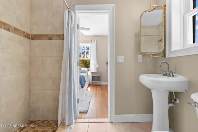 a spacious bedroom with a large bed and a window