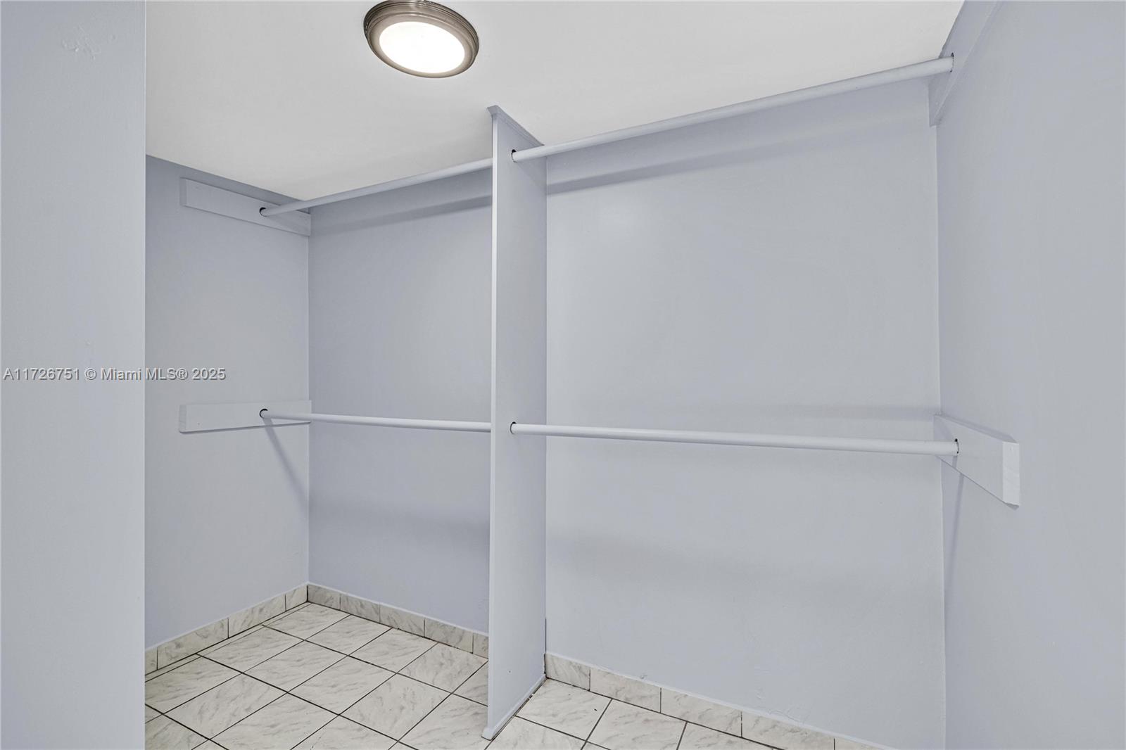 319 Northeast 171 Street North Miami Beach, FL 33162 - Photo 12 of 31 a view of an empty walk in closet