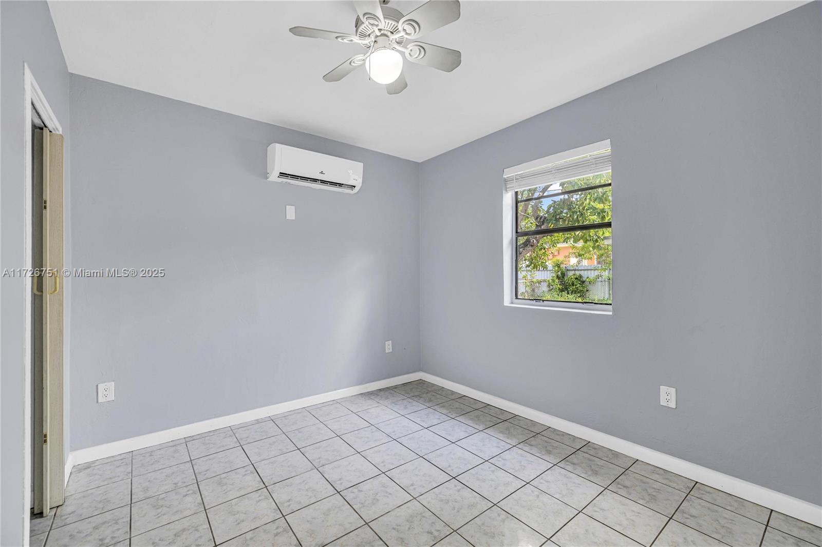 319 Northeast 171 Street North Miami Beach, FL 33162 - Photo 24 of 31 a view of an empty room with a window