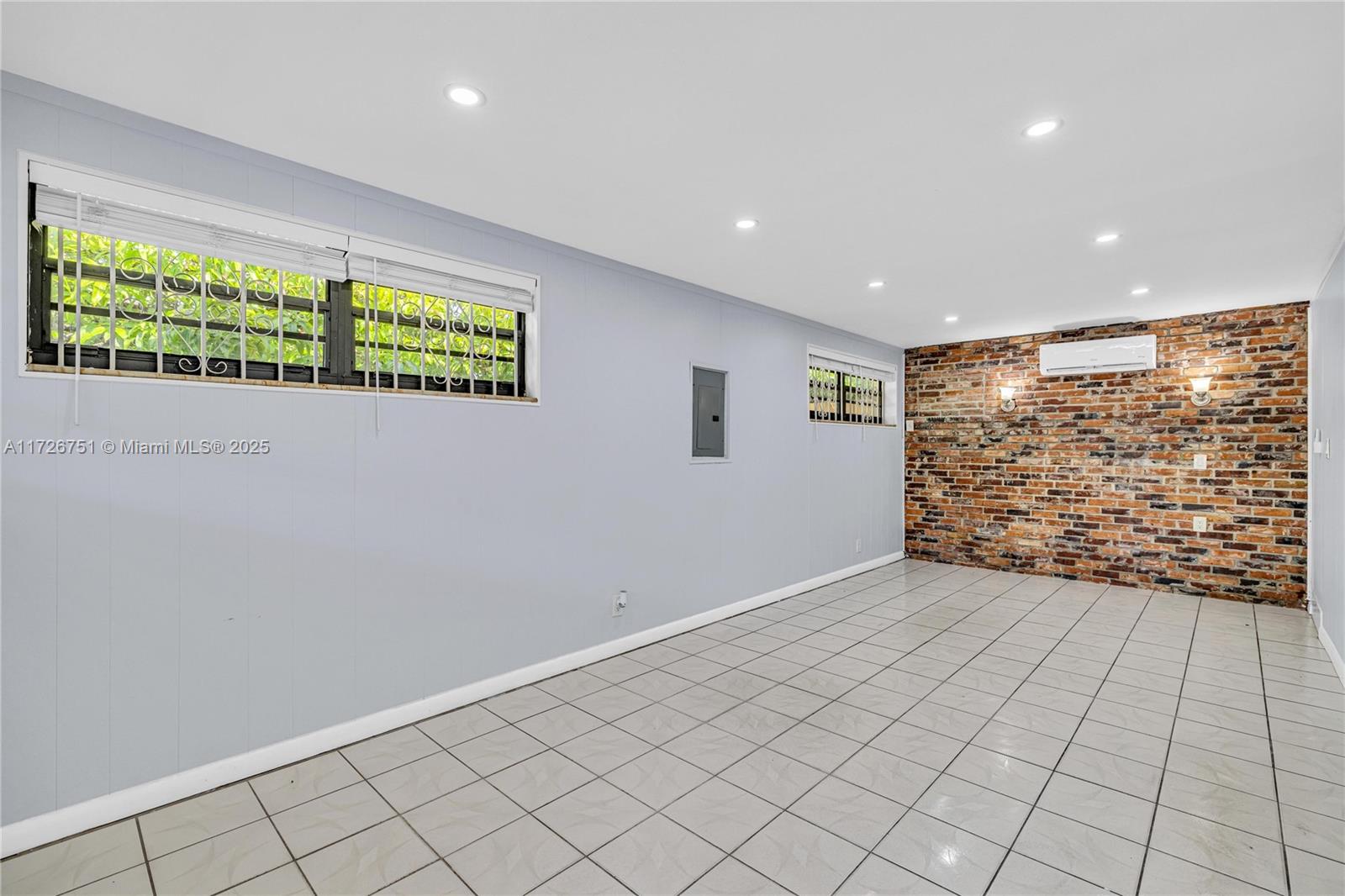 319 Northeast 171 Street North Miami Beach, FL 33162 - Photo 3 of 31 a view of an empty room with a window