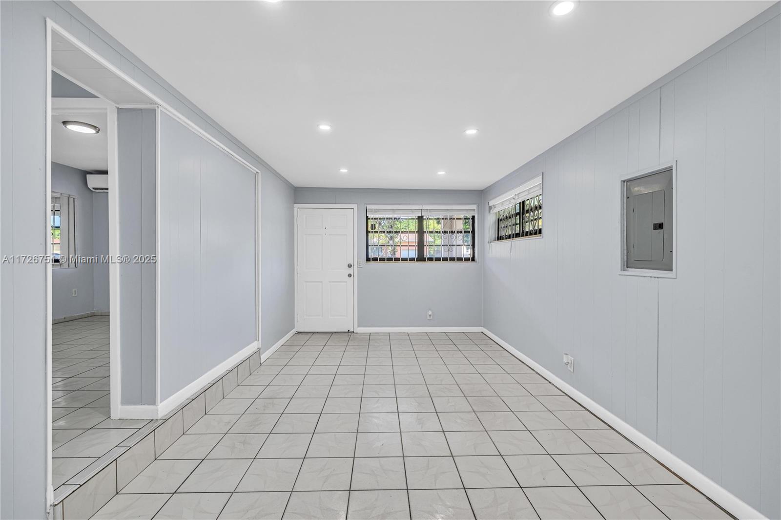 319 Northeast 171 Street North Miami Beach, FL 33162 - Photo 6 of 31 a view of an empty room and window