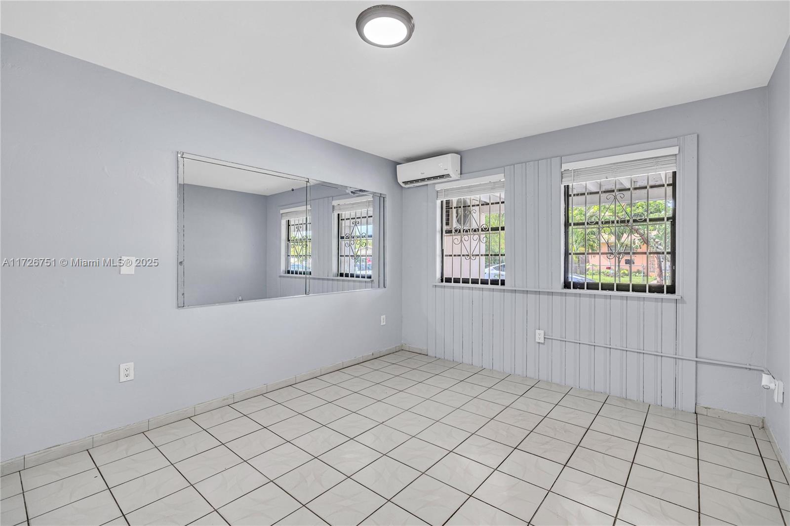319 Northeast 171 Street North Miami Beach, FL 33162 - Photo 8 of 31 a view of an empty room and window