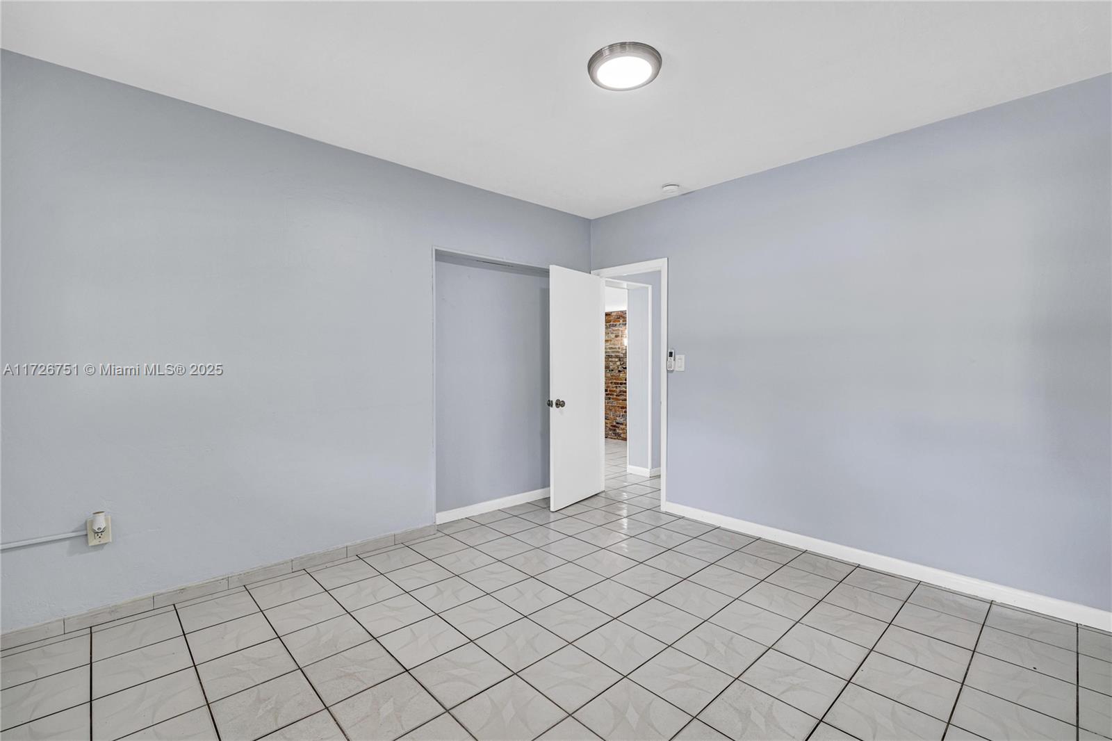 319 Northeast 171 Street North Miami Beach, FL 33162 - Photo 9 of 31 a view of an empty room