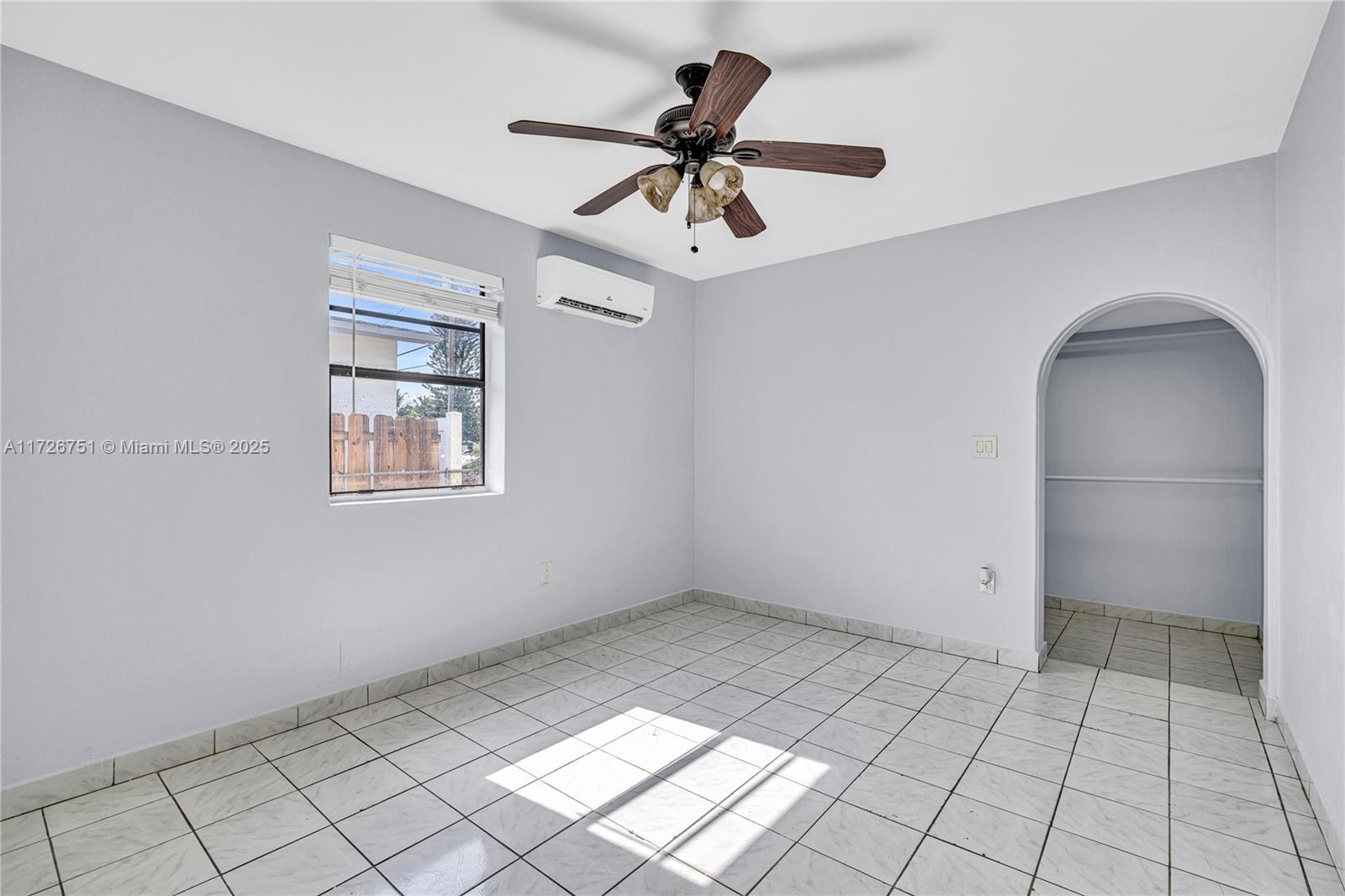 319 Northeast 171 Street North Miami Beach, FL 33162 - Photo 10 of 31 a view of an empty room and window