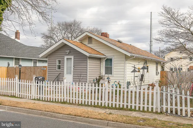 a front view of a house with a small yard