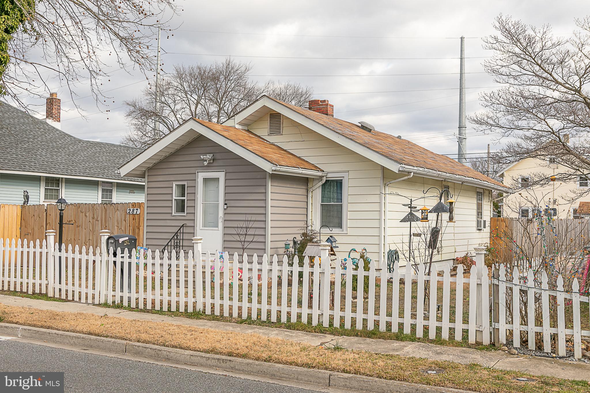287 Jefferson Street Carneys Point, NJ 08069 - Photo 1 of 31 a front view of a house with a small yard