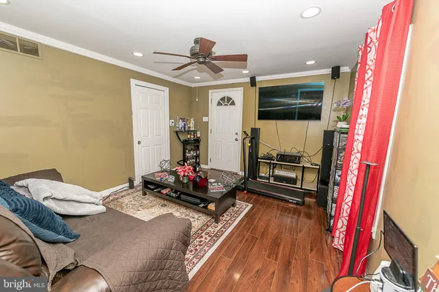 a bedroom with furniture and a flat screen tv
