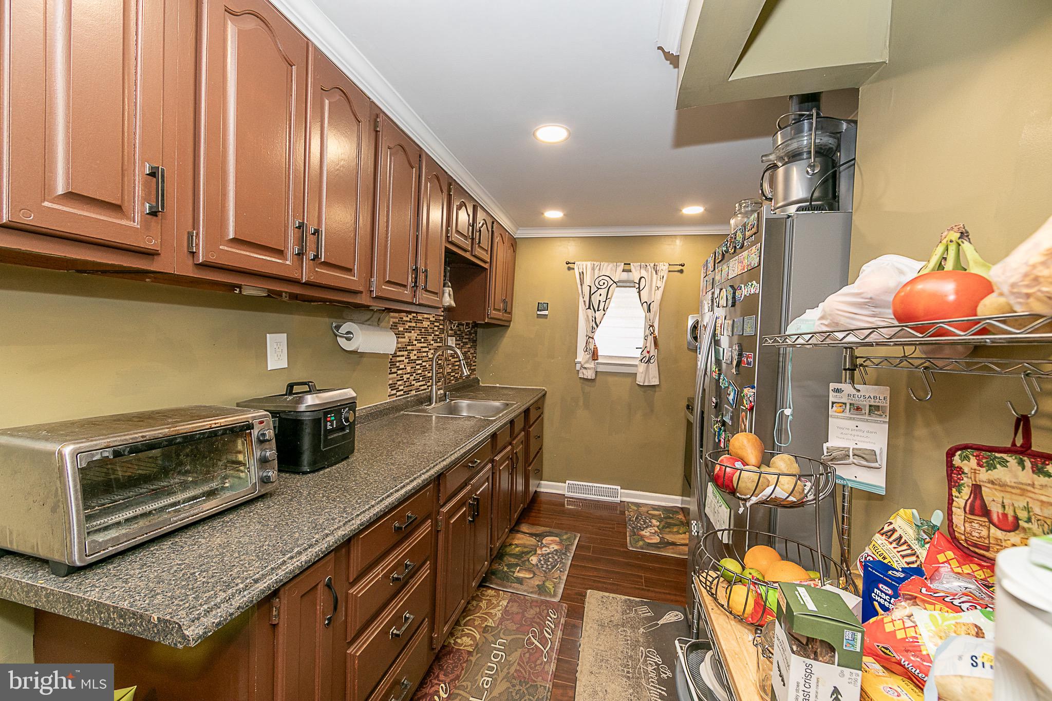 287 Jefferson Street Carneys Point, NJ 08069 - Photo 14 of 31 a kitchen with stainless steel appliances granite countertop a stove a sink dishwasher and cabinets
