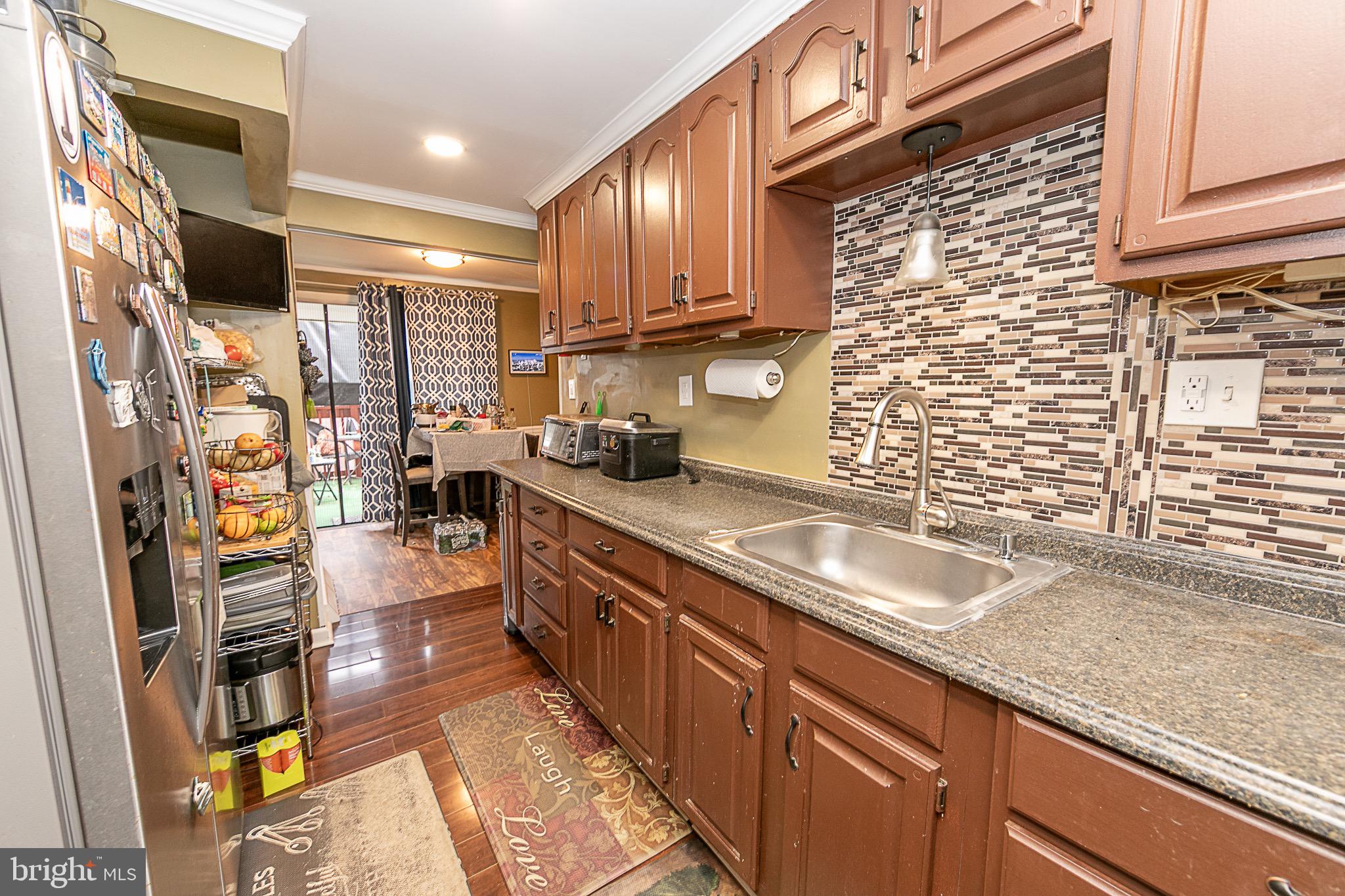287 Jefferson Street Carneys Point, NJ 08069 - Photo 16 of 31 a kitchen with stainless steel appliances granite countertop a sink stove and refrigerator