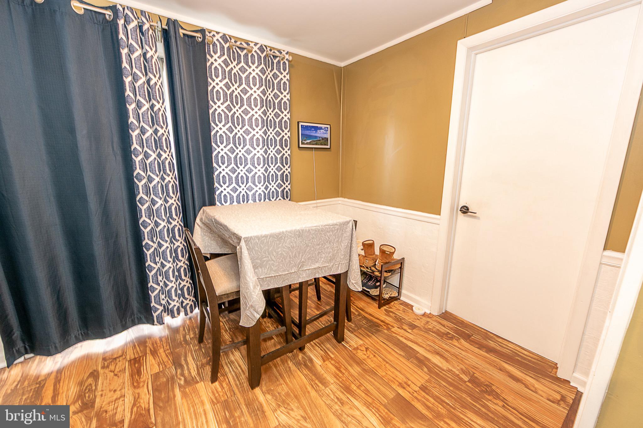 287 Jefferson Street Carneys Point, NJ 08069 - Photo 17 of 31 a dining room with furniture and wooden floor