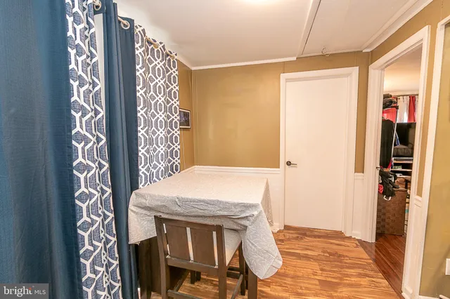 a view of a hallway with entryway door