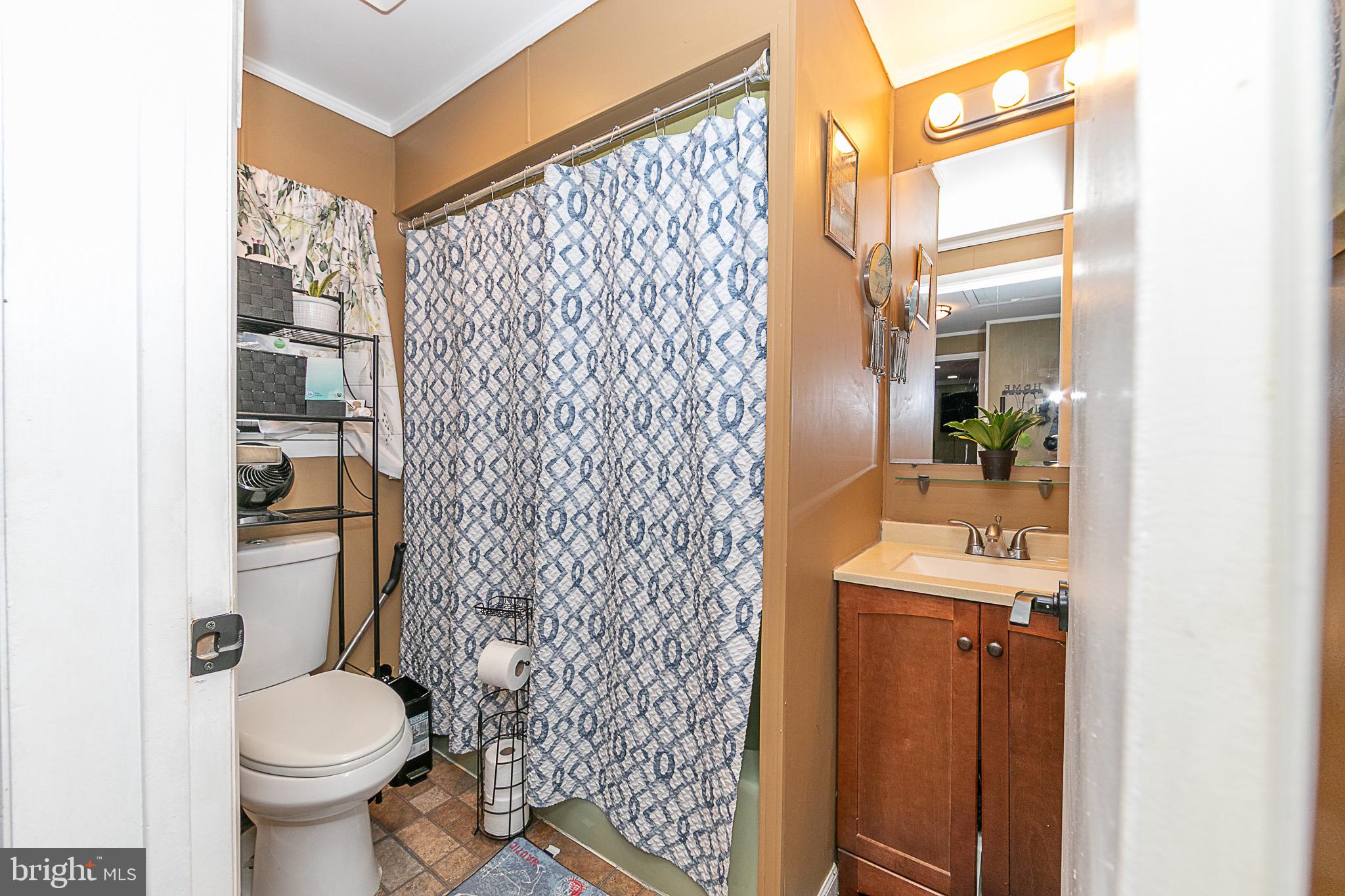 287 Jefferson Street Carneys Point, NJ 08069 - Photo 20 of 31 a bathroom with a sink toilet and shower