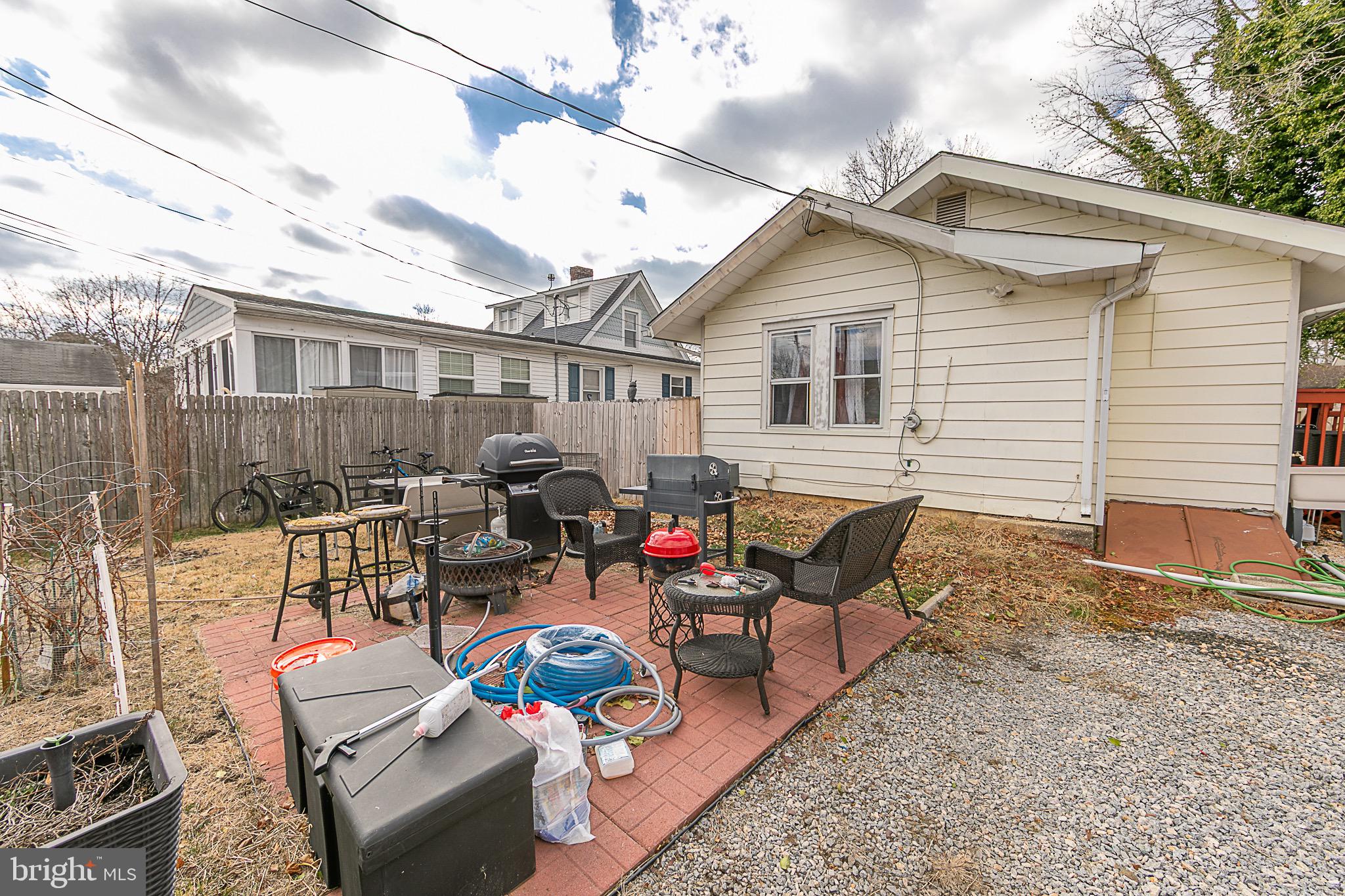 287 Jefferson Street Carneys Point, NJ 08069 - Photo 23 of 31 a backyard of a house with fire pit and chairs