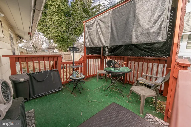 a view of a two chairs in the patio