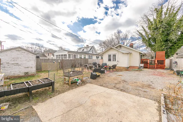 a view of a backyard with sitting area