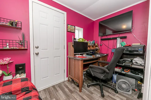 a room with furniture and a flat screen tv