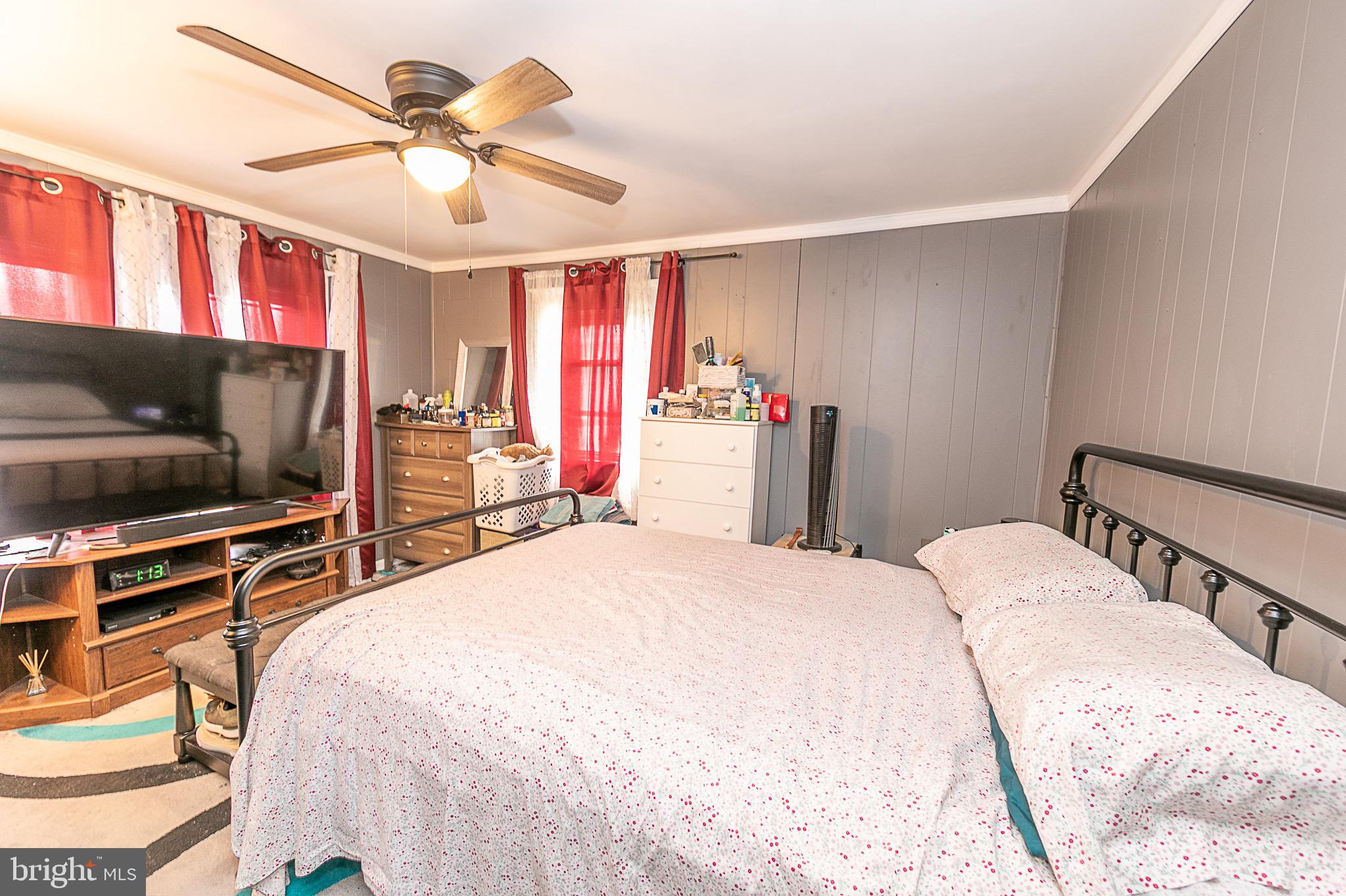 287 Jefferson Street Carneys Point, NJ 08069 - Photo 10 of 31 a bedroom with a bed and a flat screen tv