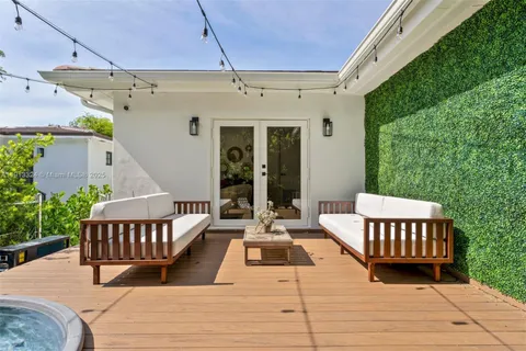 a view of a patio with wooden floor