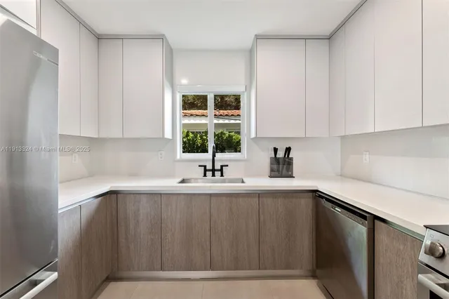 a kitchen with a sink and cabinets