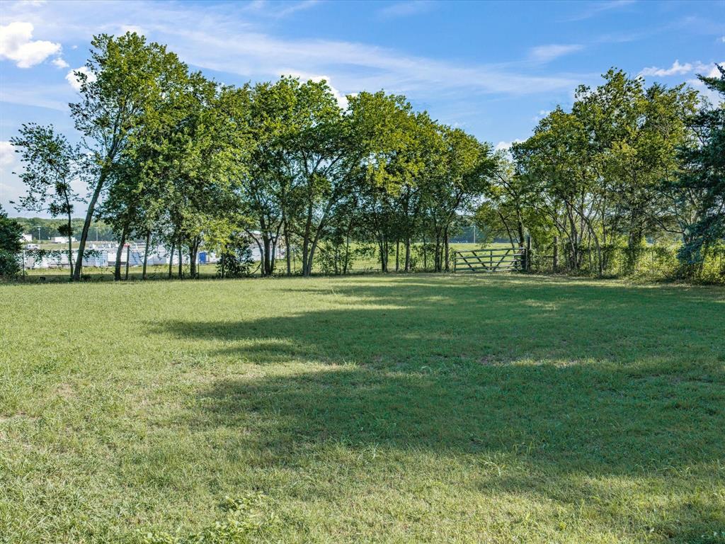 301 Ovilla Road Waxahachie, TX 75167 - Photo 8 of 38 a view of a grassy field with trees