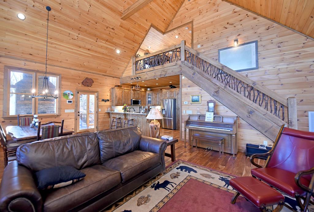 731 Native Trail Cherry Log, GA 30522 - Photo 22 of 54 a view of a livingroom with furniture and a rug