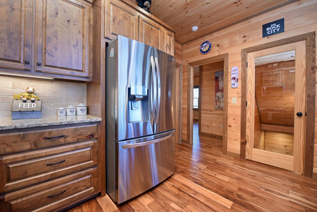731 Native Trail Cherry Log, GA 30522 - Photo 27 of 54 a kitchen with stainless steel appliances granite countertop a refrigerator and a stove top oven