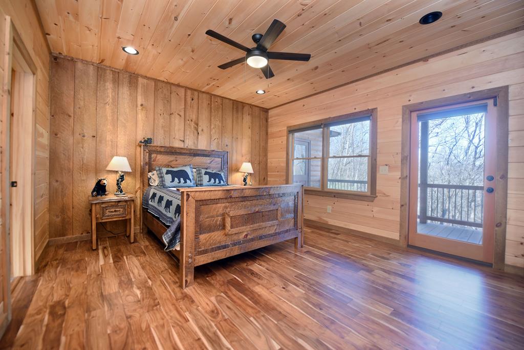 731 Native Trail Cherry Log, GA 30522 - Photo 29 of 54 a bedroom with furniture and wooden floor