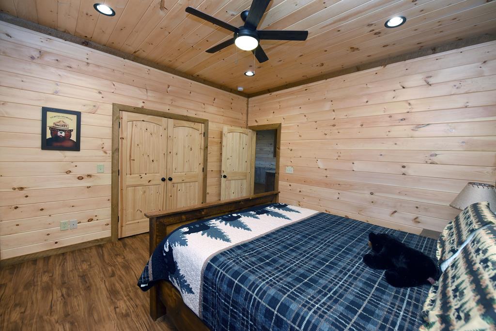 731 Native Trail Cherry Log, GA 30522 - Photo 48 of 54 a bedroom with a bed and a ceiling fan