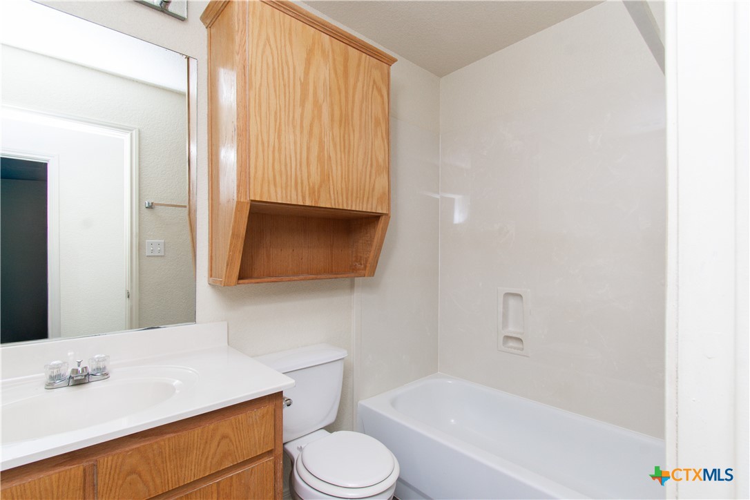 1611 Ute Trail, Unit B Harker Heights, TX 76548 - Photo 14 of 19 a bathroom with a sink toilet and shower