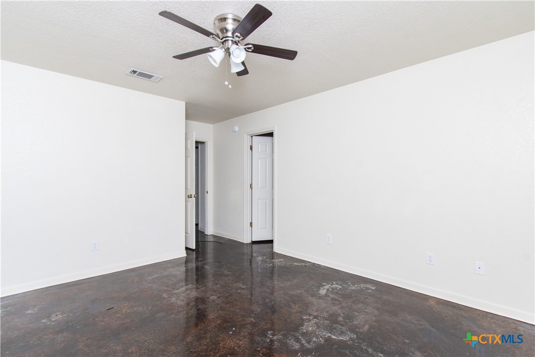 1611 Ute Trail, Unit B Harker Heights, TX 76548 - Photo 17 of 19 an empty room with a ceiling fan and a window