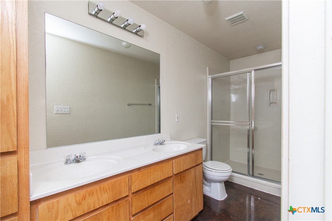 1611 Ute Trail, Unit B Harker Heights, TX 76548 - Photo 18 of 19 a bathroom with a sink a toilet and shower