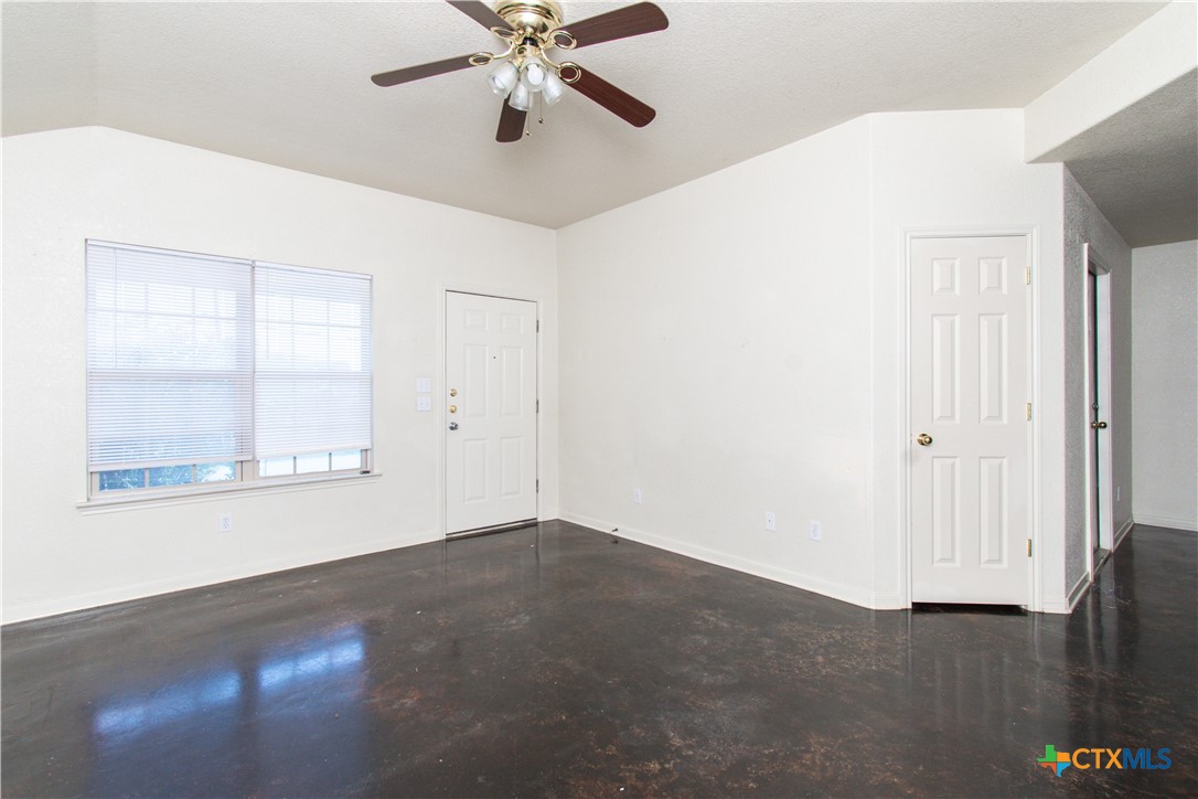 1611 Ute Trail, Unit B Harker Heights, TX 76548 - Photo 4 of 19 an empty room with a window and wooden floor