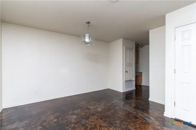 a kitchen with stainless steel appliances a stove top oven