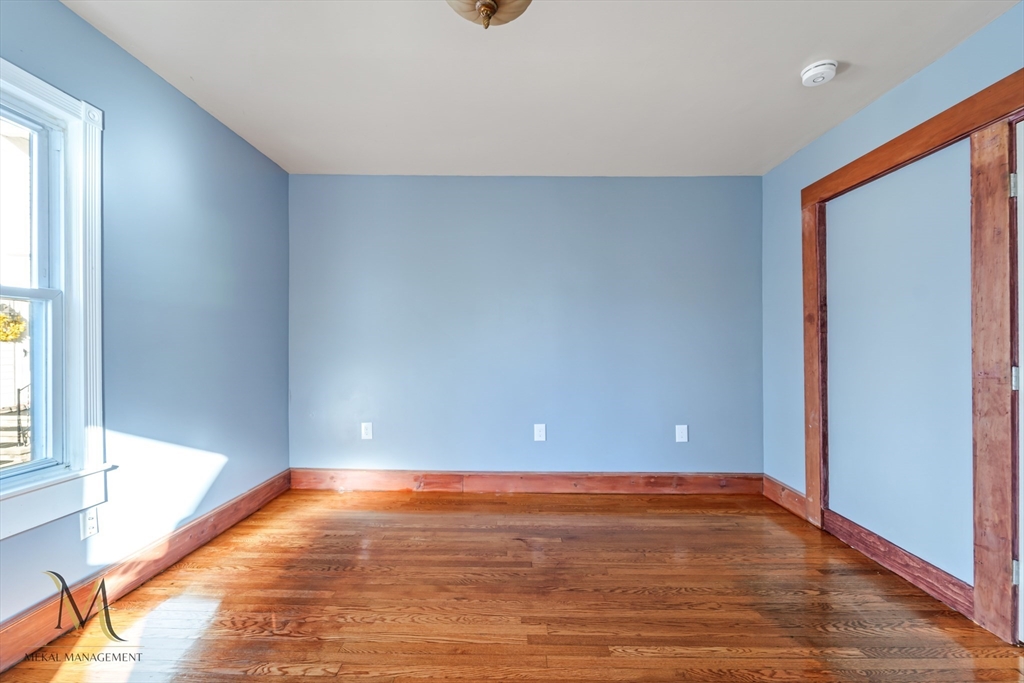 19-21 Daniel Street, Unit 19 Springfield, MA 01151 - Photo 14 of 26 a view of room with window and wooden floor