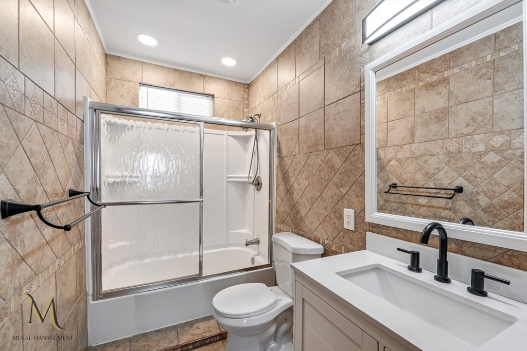 19-21 Daniel Street, Unit 19 Springfield, MA 01151 - Photo 22 of 26 a bathroom with a sink toilet and shower