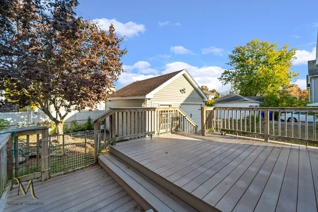 a view of a wooden deck with a yard