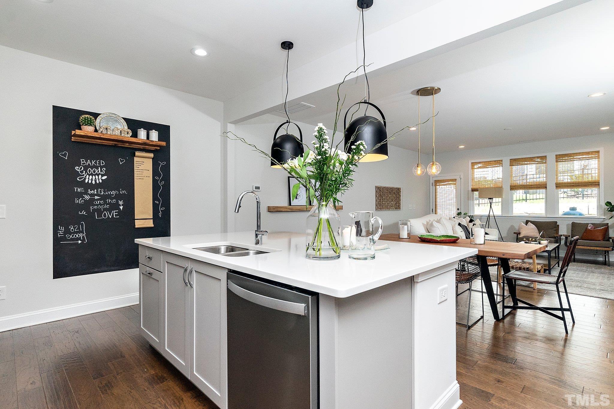 821 Malta Way Durham, NC 27703 - Photo 11 of 30 a kitchen with a table and chairs in it