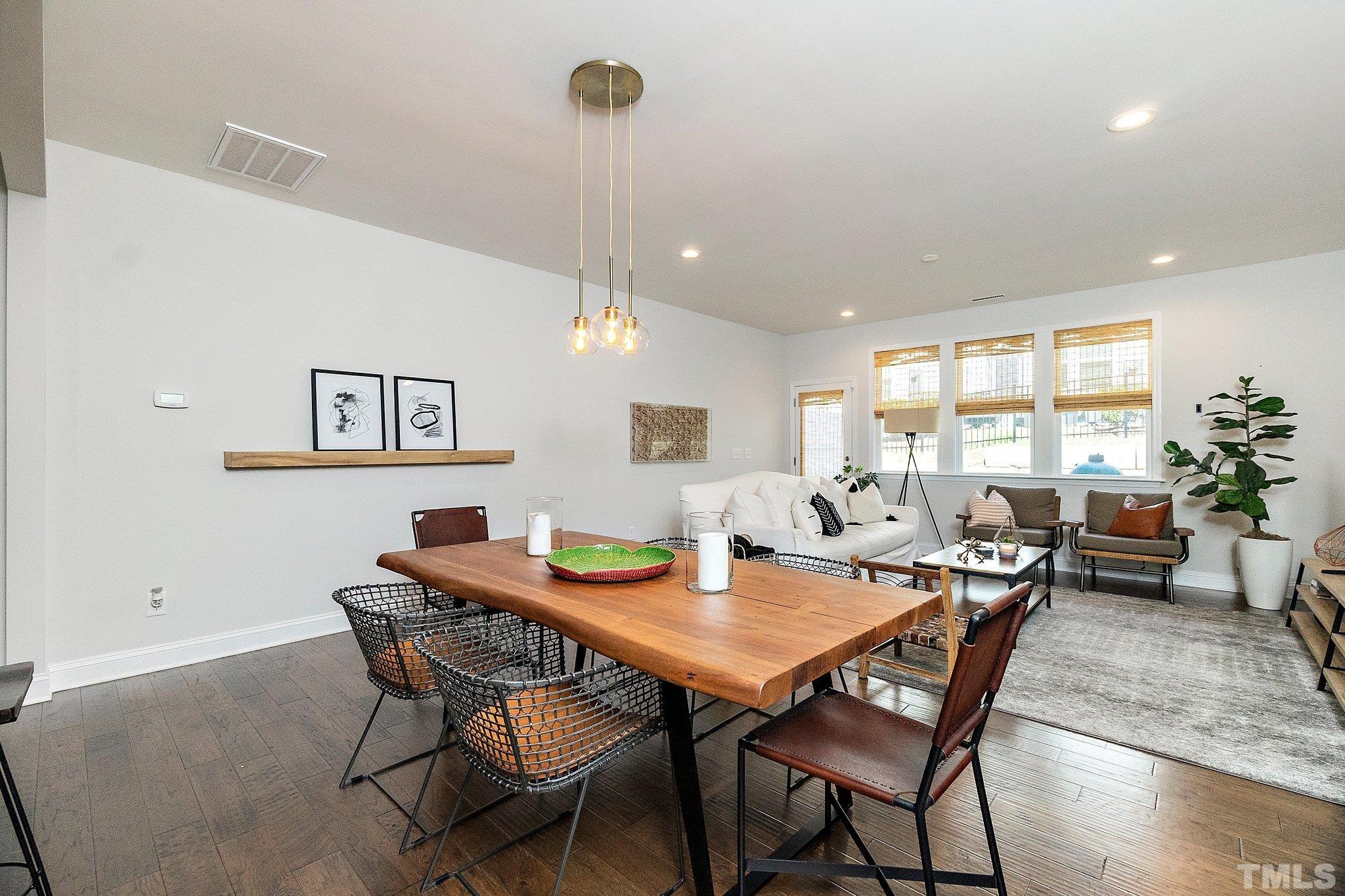 821 Malta Way Durham, NC 27703 - Photo 13 of 30 a view of a dining room with furniture