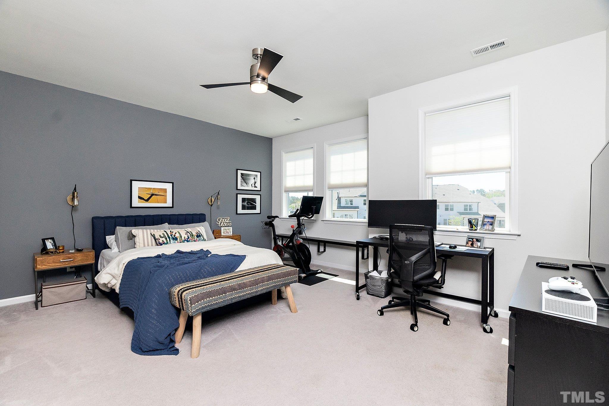 821 Malta Way Durham, NC 27703 - Photo 22 of 30 a bedroom with a bed and a desk