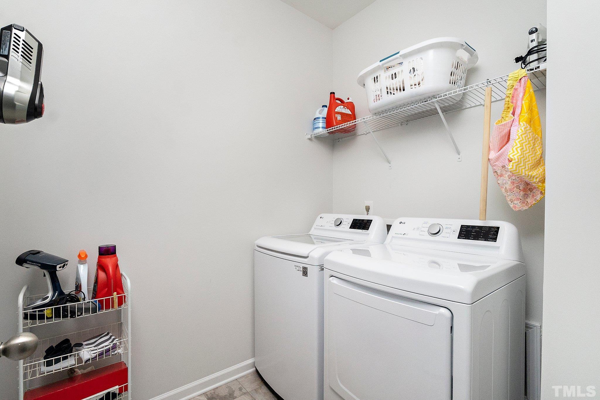 821 Malta Way Durham, NC 27703 - Photo 24 of 30 a utility room with dryer and washer