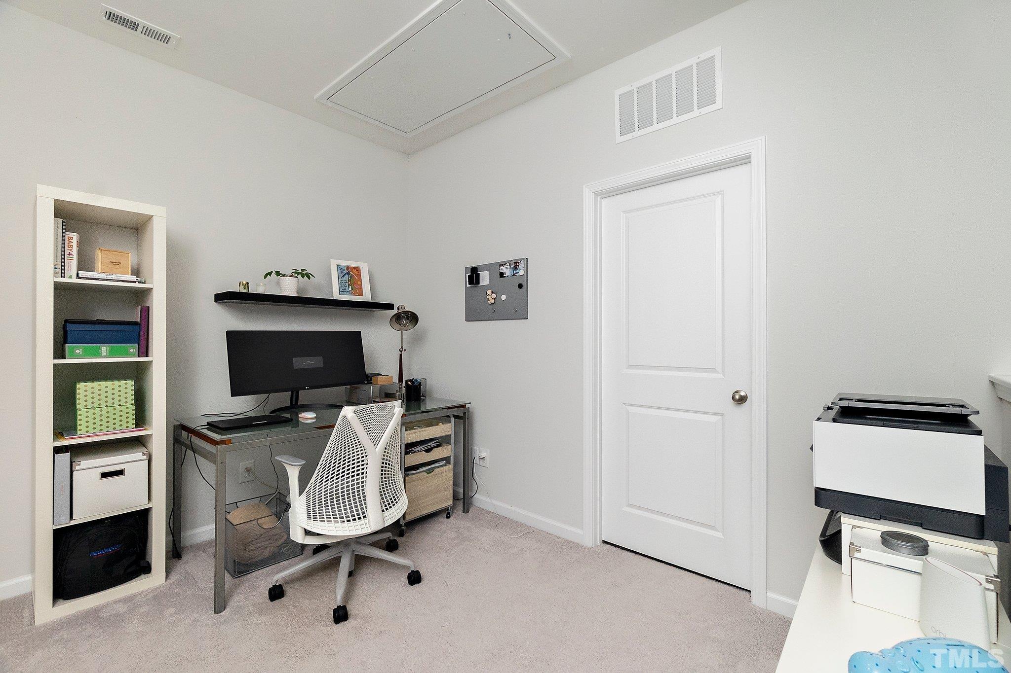 821 Malta Way Durham, NC 27703 - Photo 25 of 30 a view of a workspace with furniture and a window