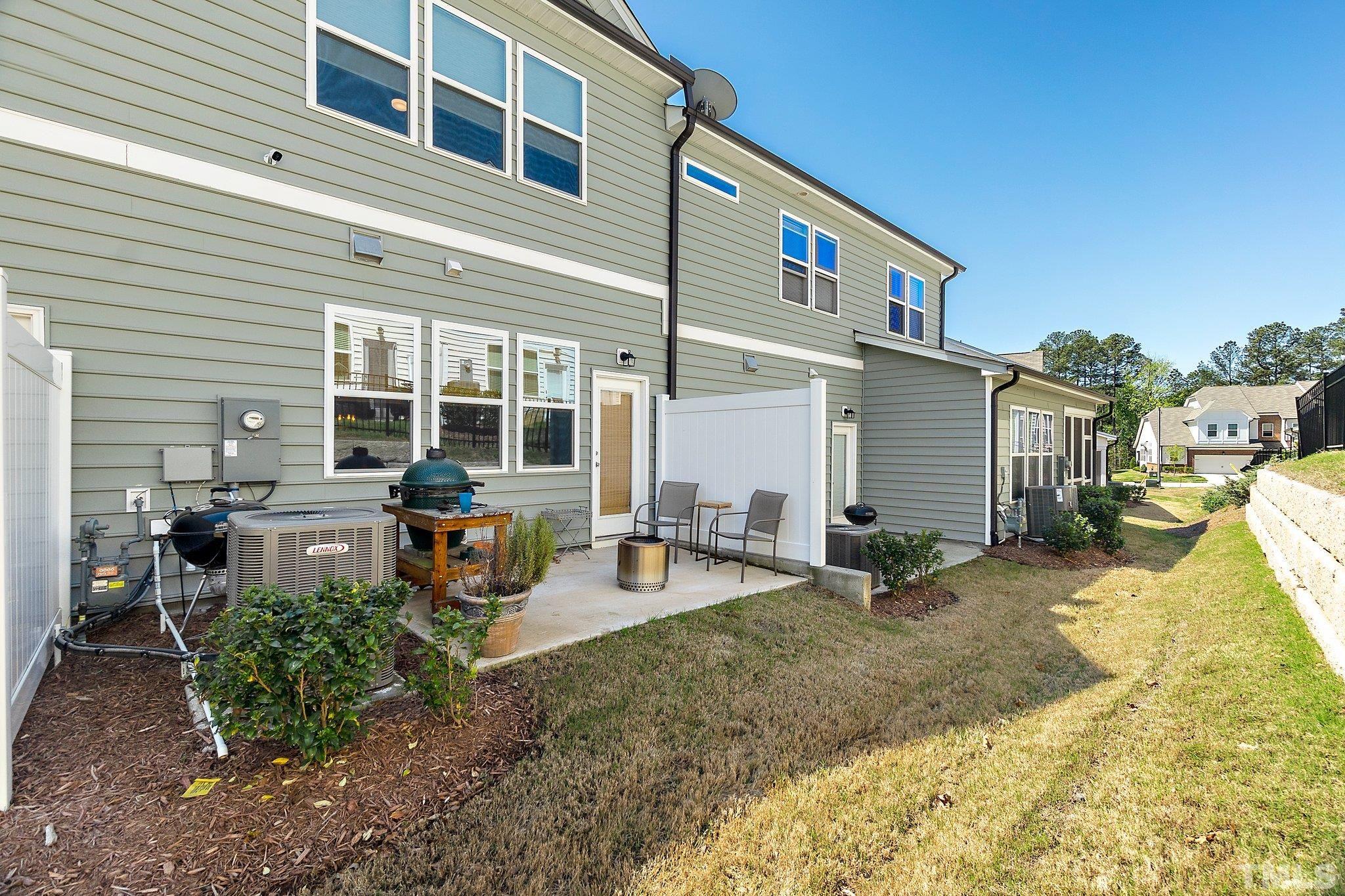 821 Malta Way Durham, NC 27703 - Photo 28 of 30 a view of a house with backyard and sitting area