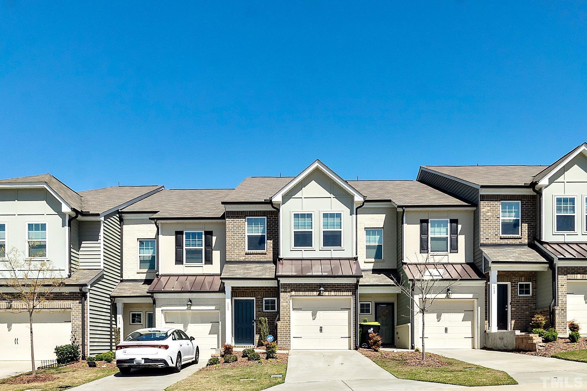 821 Malta Way Durham, NC 27703 - Photo 3 of 30 a front view of a residential apartment building with a street