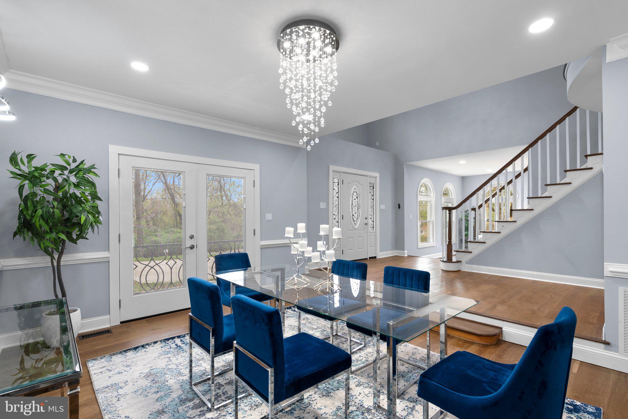 2924 Hunter Road Fairfax, VA 22031 - Photo 18 of 79 a living room with furniture a chandelier and a large mirror with wooden floor