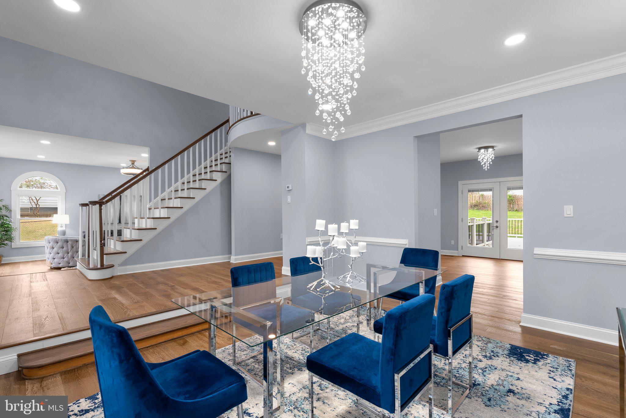 2924 Hunter Road Fairfax, VA 22031 - Photo 19 of 79 a living room with furniture a dining table and a chandelier